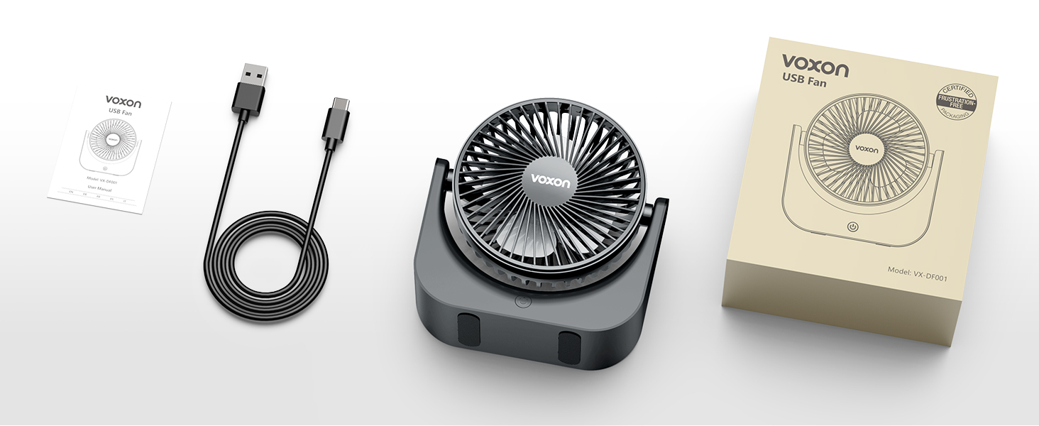 Small black USB-powered desk fan with product packaging. USB cable and instruction manual visible alongside the device.
