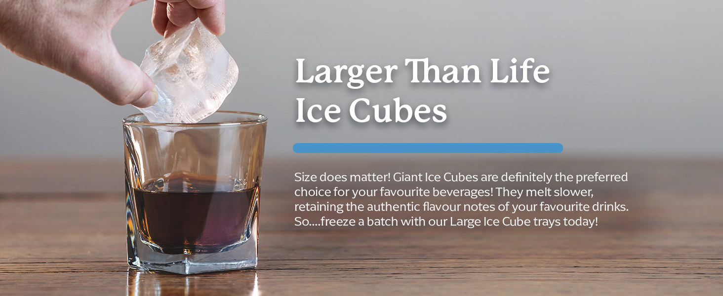 large silicone ice cube being placed in a glass with scotch