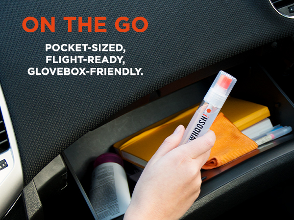 Hand placing WHOOSH! screen cleaner in a car glovebox, emphasizing its portability.