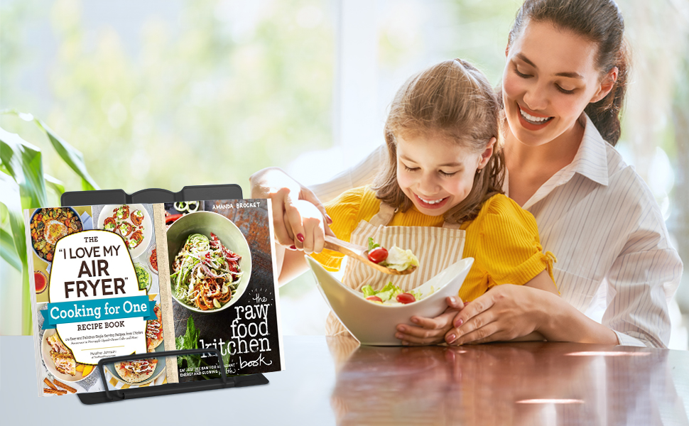 a woman and child eating a meal
