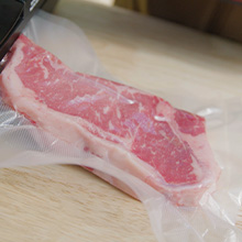 LEM vacuum sealer bag with meat sealed inside to help preserve freshness