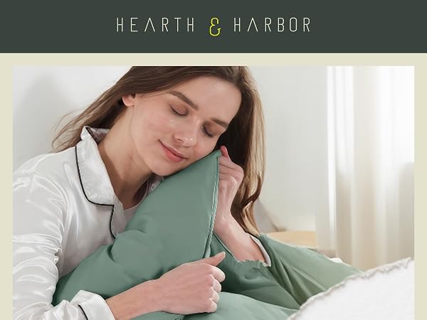 Woman holding duvet cover next to her face