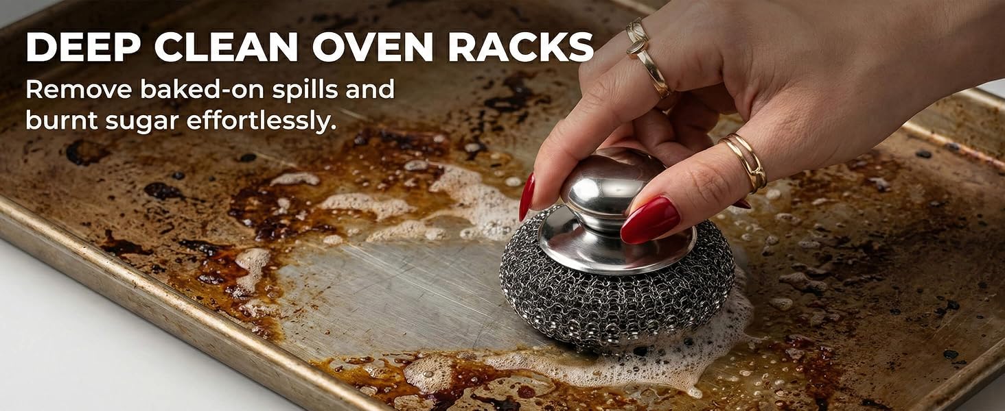 Metal scrubber removing baked-on grease from stainless steel oven racks and trays.