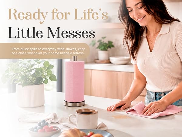 Woman wiping kitchen countertop with reusable microfiber cloth
