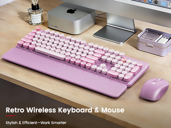 Lavender purple retro wireless keyboard and mouse with magnetic wrist rest on a wooden desk