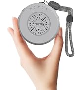 Hand holding up a compact FOXFINE portable sound machine, showing its portable design, wn03 grey