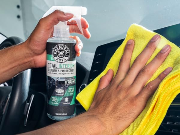 Wiping car leather seats with Total Interior Cleaner microfiber towel