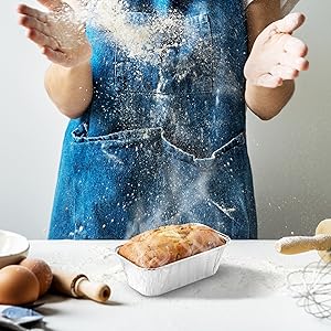 baker using loaf pan for baking bread