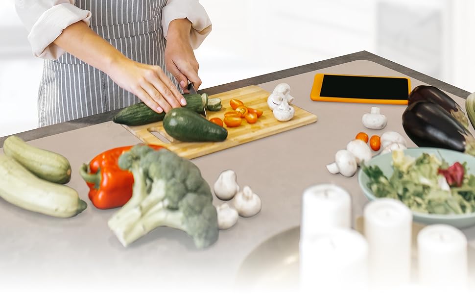 A woman using our premium silicone mat in the kitchen, heat resistant mat countertop