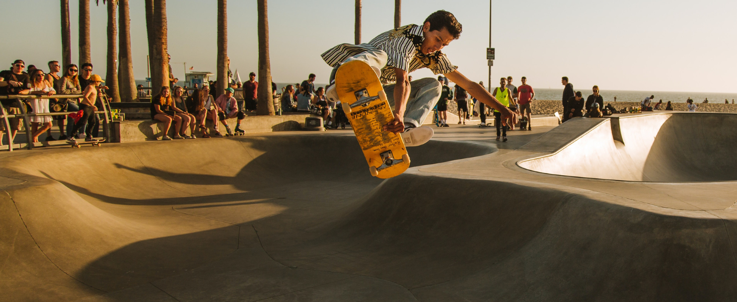 man at the skate park doing a trick