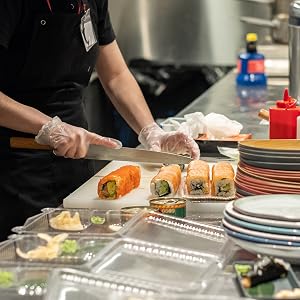 Picture showing a chef wearing disposable gloves preparing food