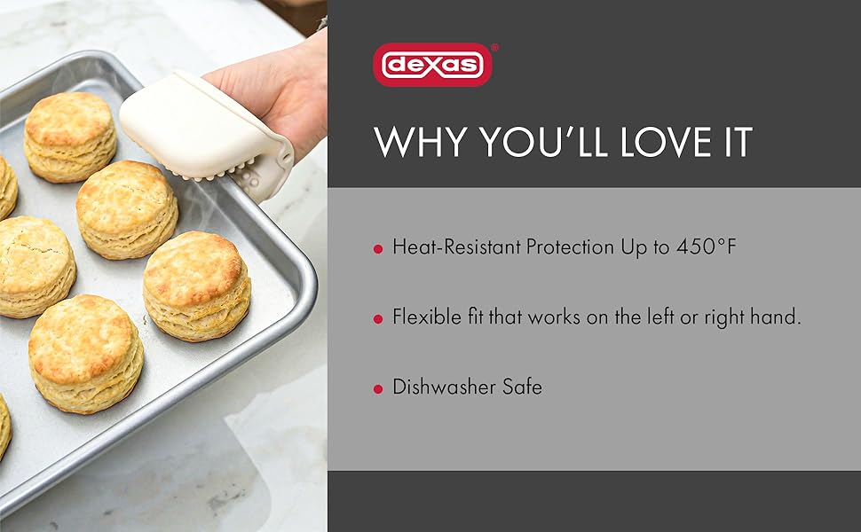silicone mitt holding metal tray of biscuits