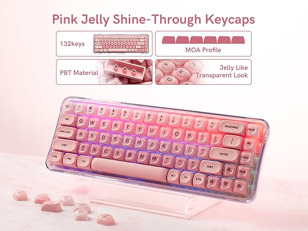A keyboard featuring pink jelly shine-through keycaps, with 132 keys