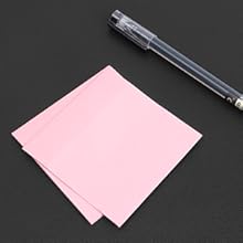a pair of pink paper and a pen