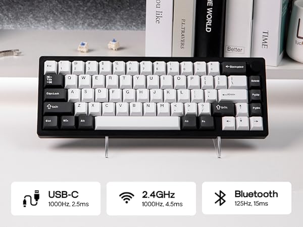 Compact mechanical keyboard with white and gray keys on a black frame. Features USB-C connectivity, 2.4GHz wireless, and Bluetooth compatibility, displayed with technical specifications.