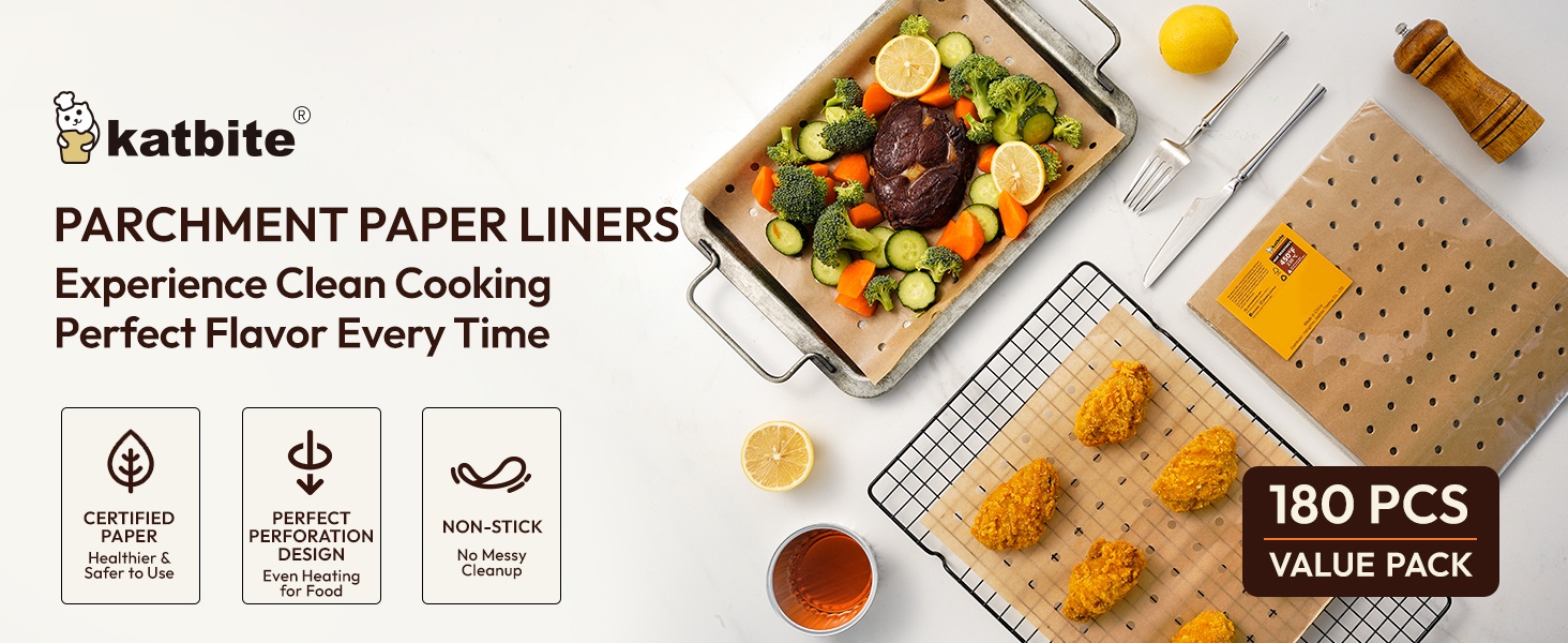 a tray of food with a tray of meat, vegetables, and a lemon on the side.