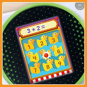 Close up of a math learning screen with numbered ducks. 3+2=