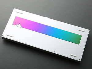 Rectangular color gradient sample showing a smooth transition from pink to blue to green on a white background.