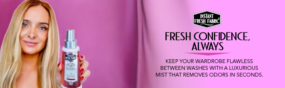 Woman holding bottle of Clothes Freshener.