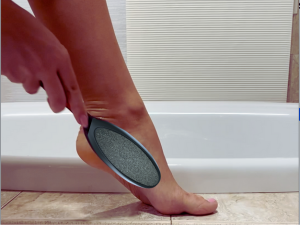 Using Coarse (stainless steel) side. to remove thick, calloused skin