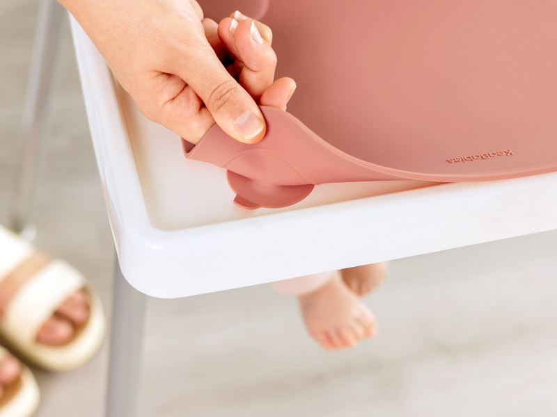 Prep silicone placemat showing flexible design and secure grip while attached to high chair tray