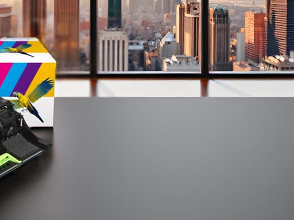 A modern office desk with a sleek laptop and a potted plant, showcasing the product in a professiona