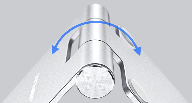 Close-up of a silver mechanical device with rotating arrows, suggesting adjustable or movable parts.