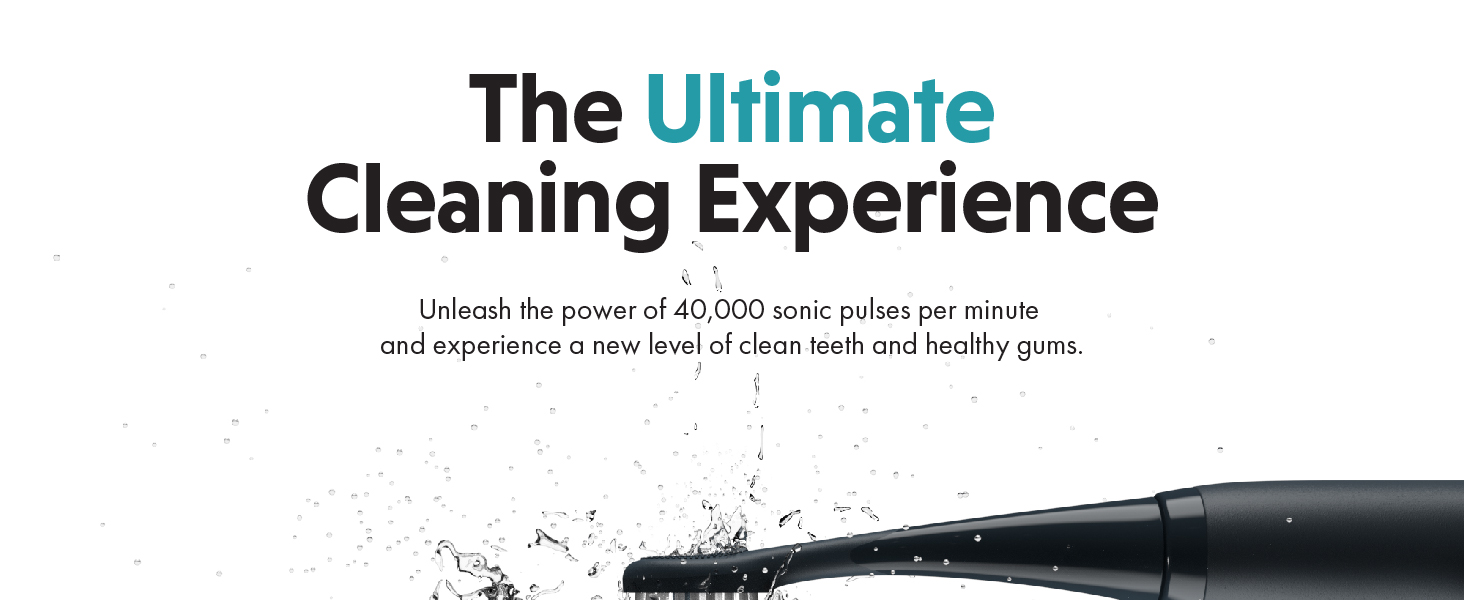 Close-up of a black cleaning tool tip with bristles, showcasing its powerful cleaning capability with water droplets and debris scattered around.