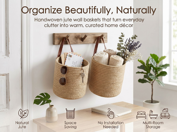 Handwoven jute wall baskets hanging in a bright boho entryway holding towels, keys, sunglasses, etc.