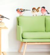 Minimalist scene showing bright lime green armchair against white wall, with small decorative birds perched along top of wall.