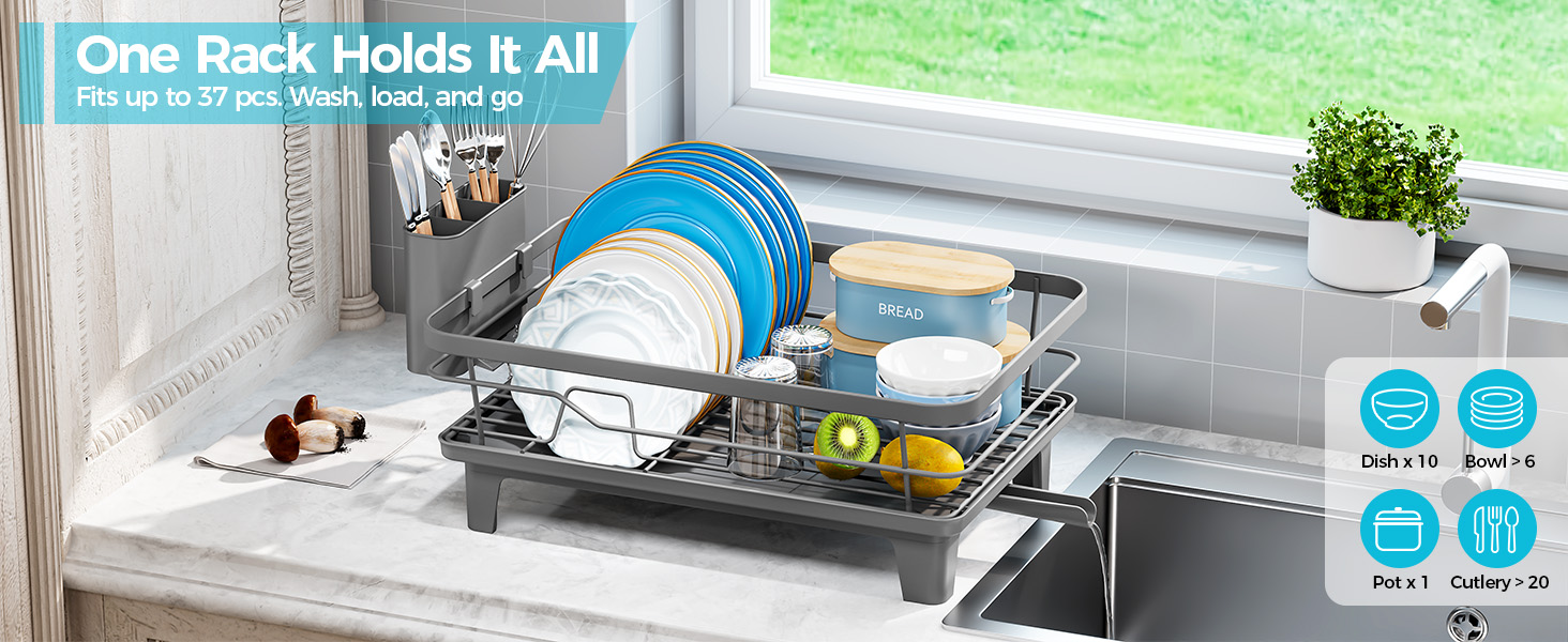 Text reads "One Rack Holds It All" and "Fits up to 27 lbs. Wash, load, and go." Dish drying rack in counter with plates, bowls, cutlery, potted plant, and yellow measuring tools displayed in kitchen setting.