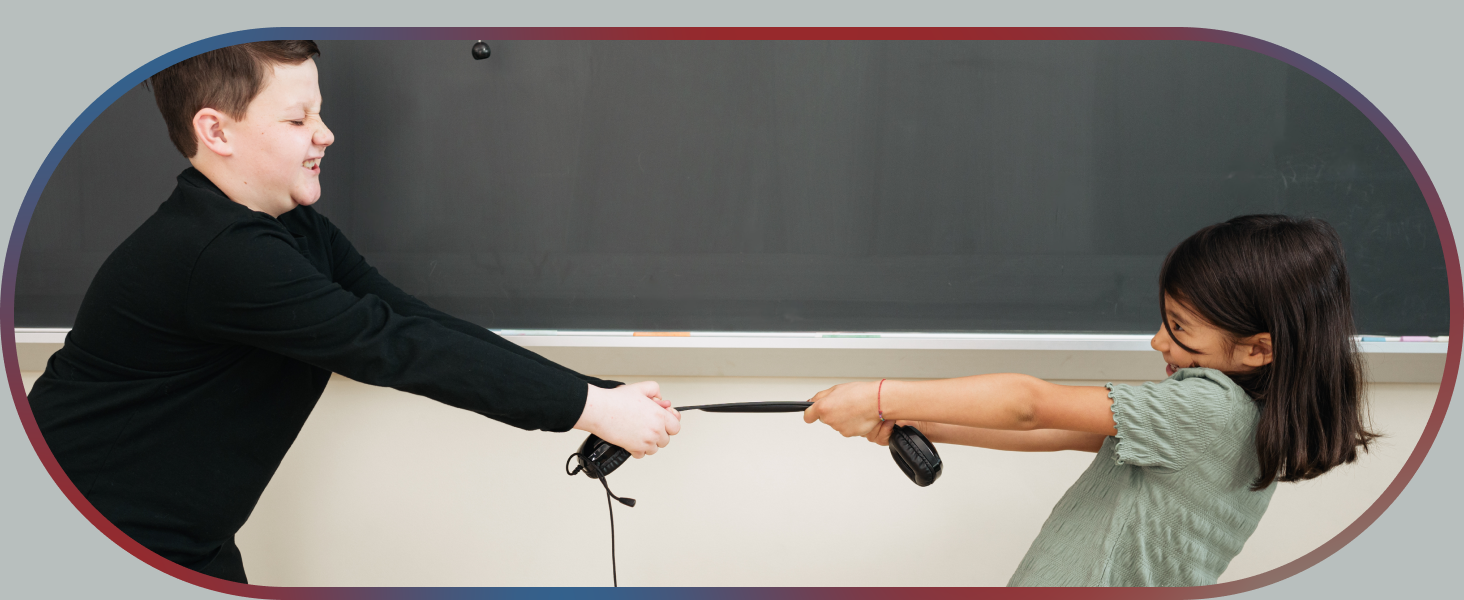 Two children attempting to pull apart a Cyber Acoustics headset
