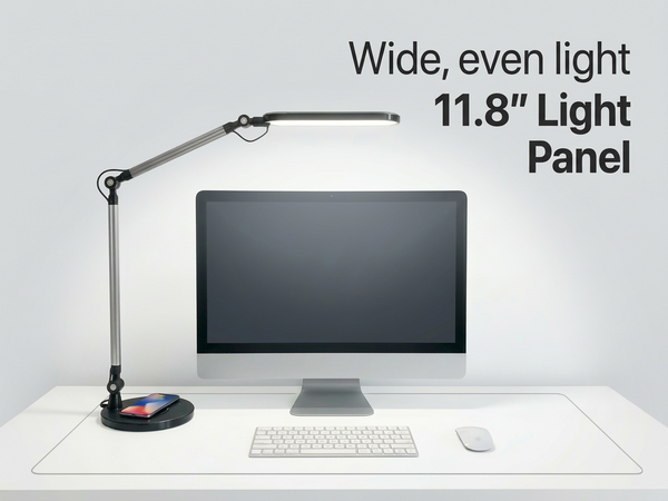 LED desk lamp providing wide even lighting across a dual monitor desk setup