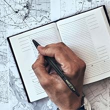 Photo shows person writing in a planner with the G2 Edge pen