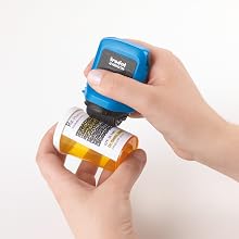 Stamp being used on prescription bottle to protect personal information