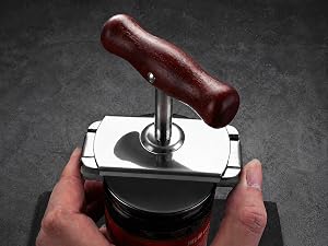step two clamp the opener heads around a plain jar lid