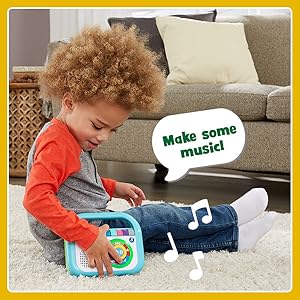 Kid plays with music player while music plays, and player says: Make some music!