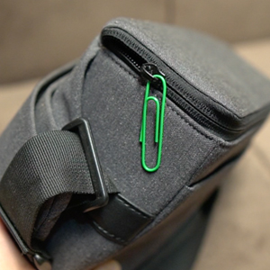 Green paper clip used as bag's zip