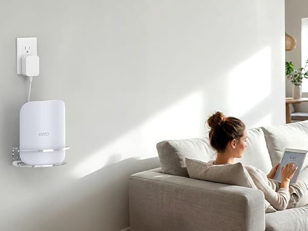 Multiple views of a white wall-mounted device in a minimalist home setting. Device appears to be some kind of electronic unit mounted at eye level.
