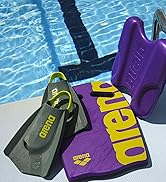 closeup of arena training swim fins kickboard and pull kick by the pool bold purple