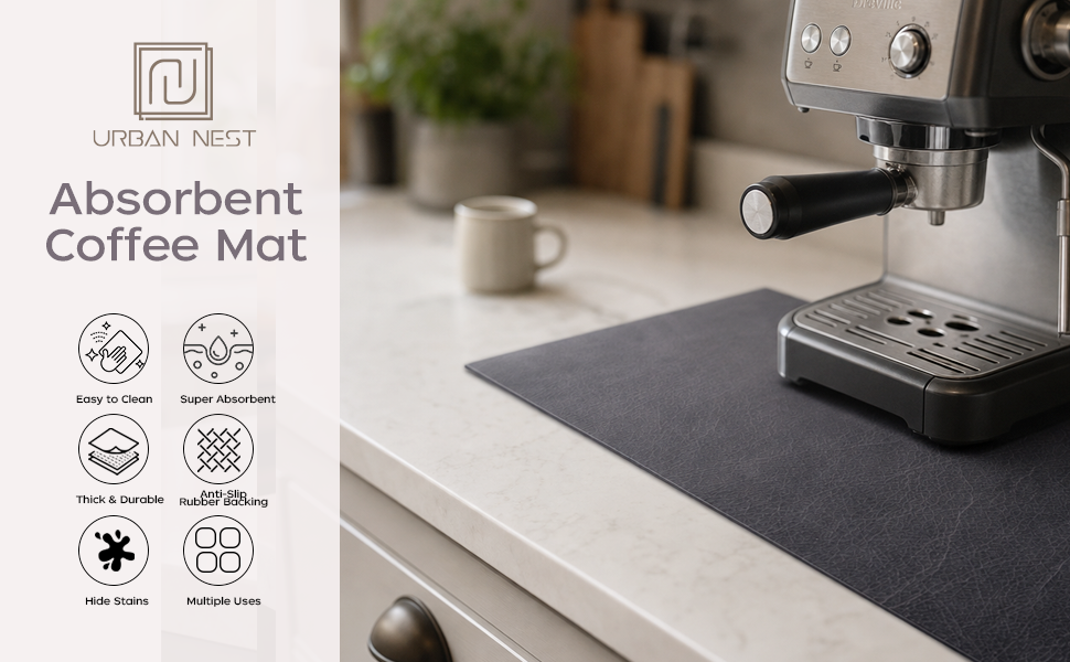 Black absorbent coffee mat under an espresso machine with easy-clean, non-slip backing.