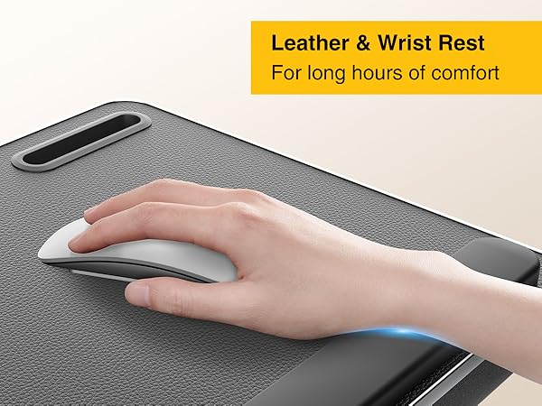 Hand resting on leather wrist pad while using wireless mouse on ergonomic lap desk.