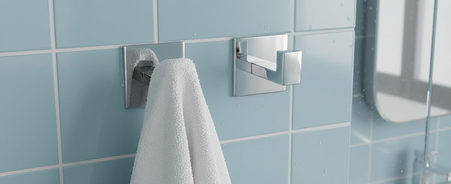 Modern bathroom interior with light blue tiled walls, featuring multiple mounted white fixtures and accessories.