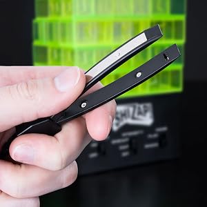 Hand holding shock tweezers