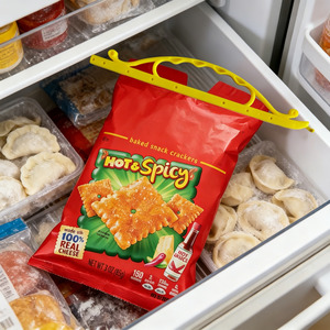 Bag sealing clip sealing frozen food bag inside freezer drawer