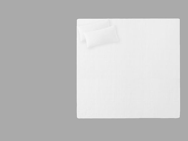 Oversized king quilt set in natural white with decorative stitching and soft feel