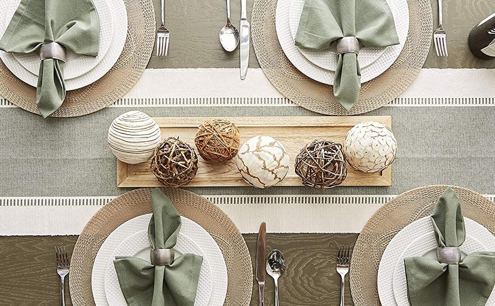 An image of a full dinner table setting with braided placemats