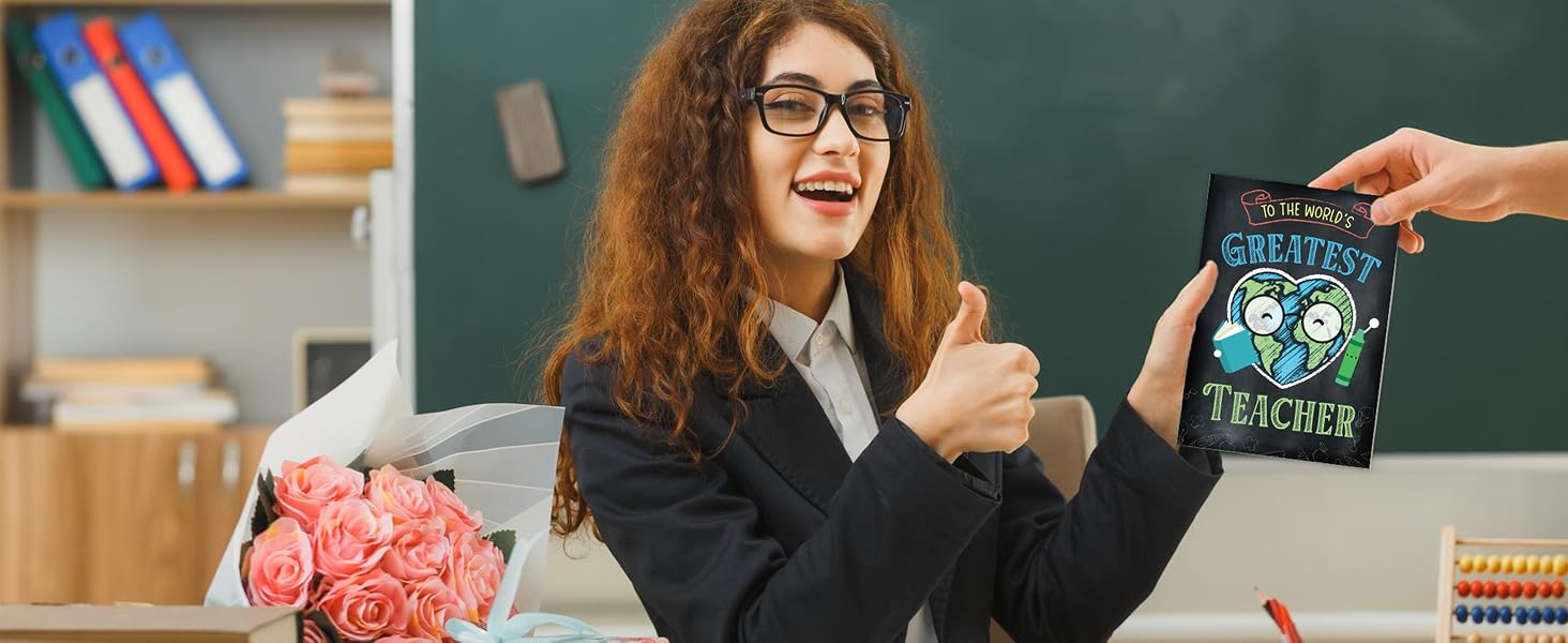 A happy teacher gives a thumbs-up while receiving a colorful teacher thank you card.