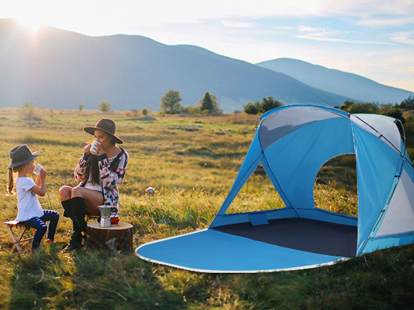 A mother and daughter camping next to a tent