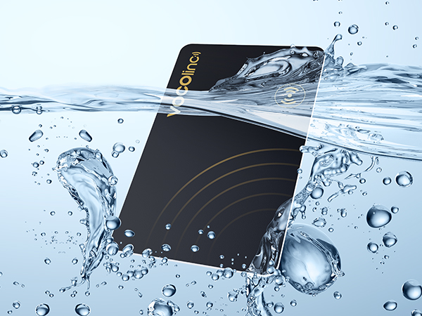 Black rectangular device submerged in water with splashes and bubbles, demonstrating its waterproof capabilities.